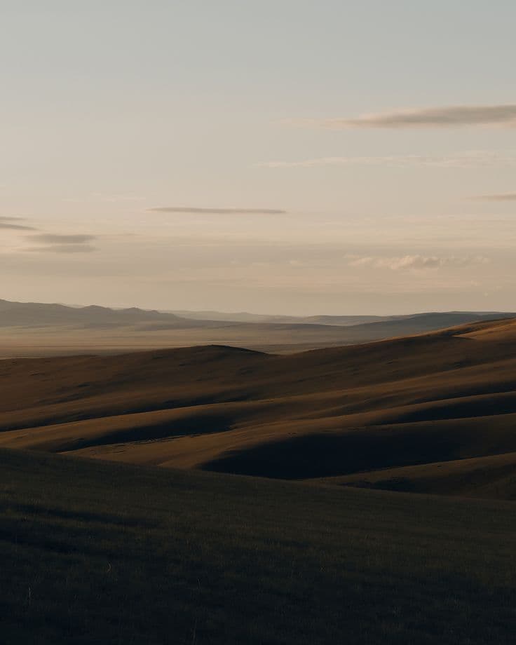 Soft evening light over rolling hills