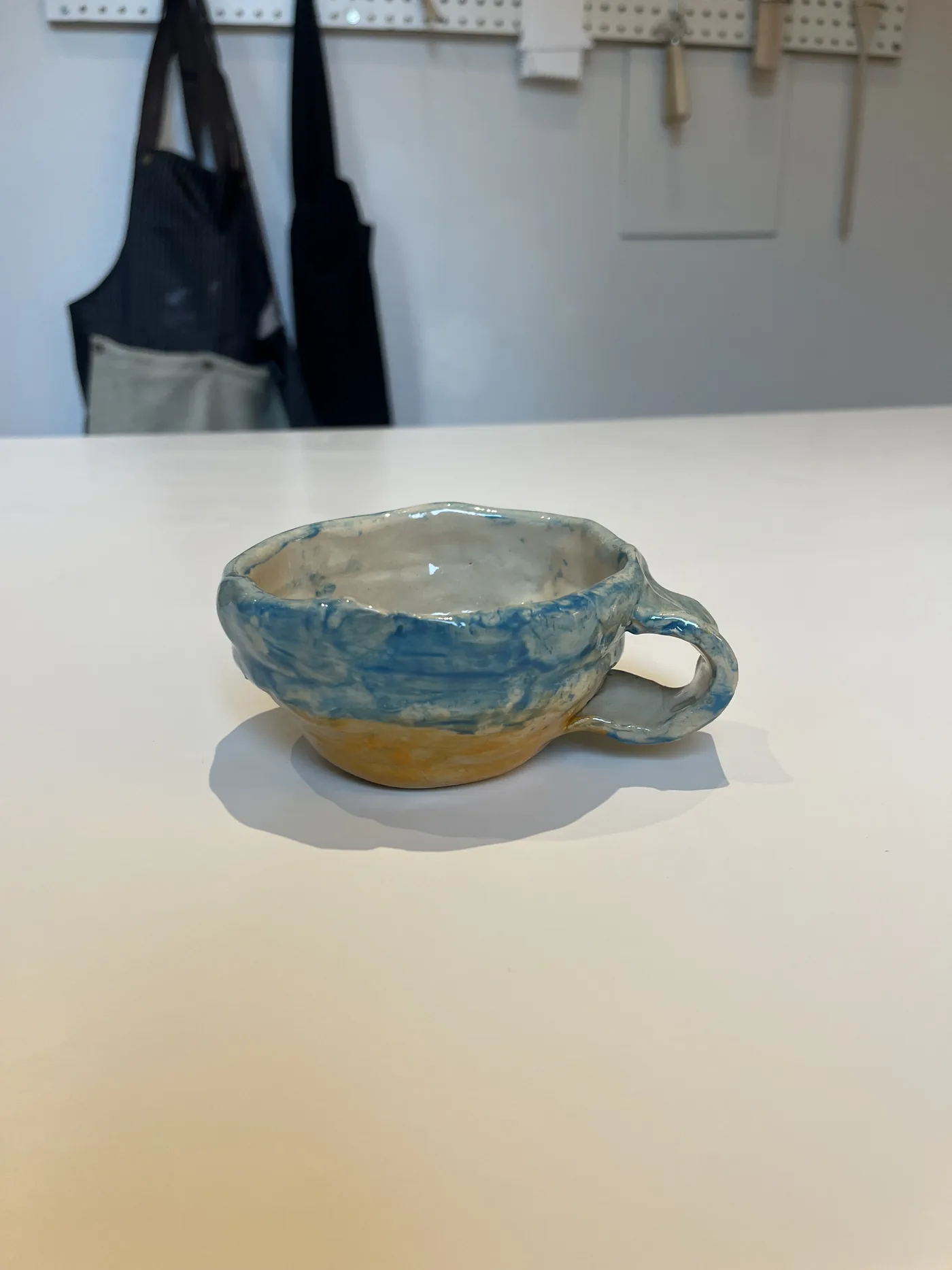 Blue and yellow handled bowl made by an SAH guest in 2026