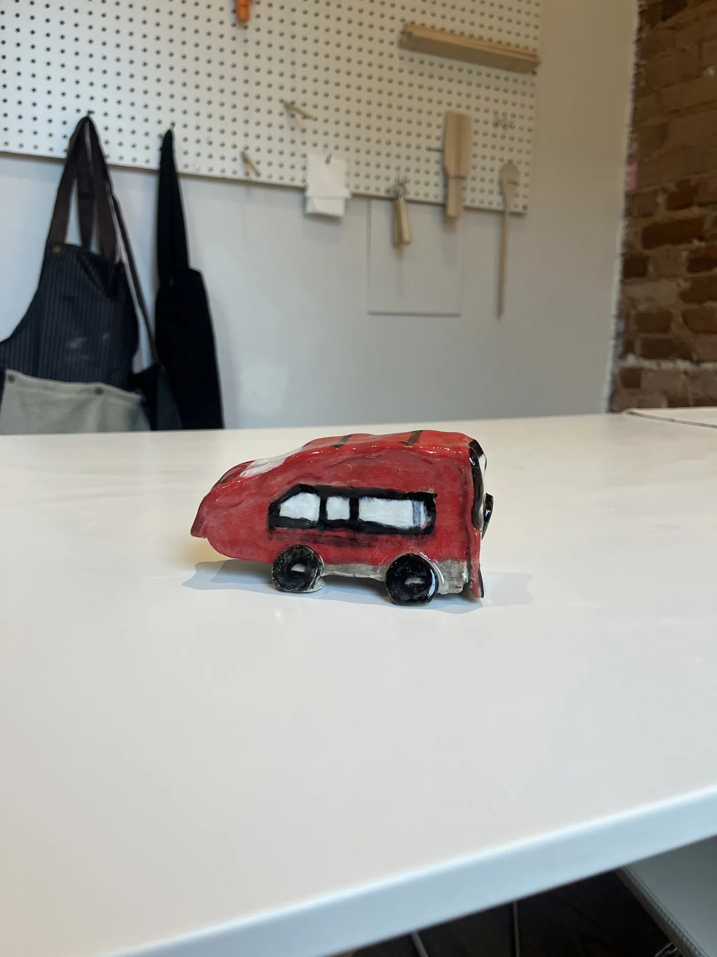 Red bus sculpture made by an SAH guest in 2026