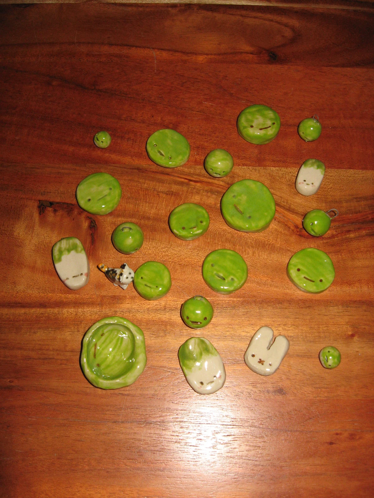 Green man and friends pieces made by Kat in 2026