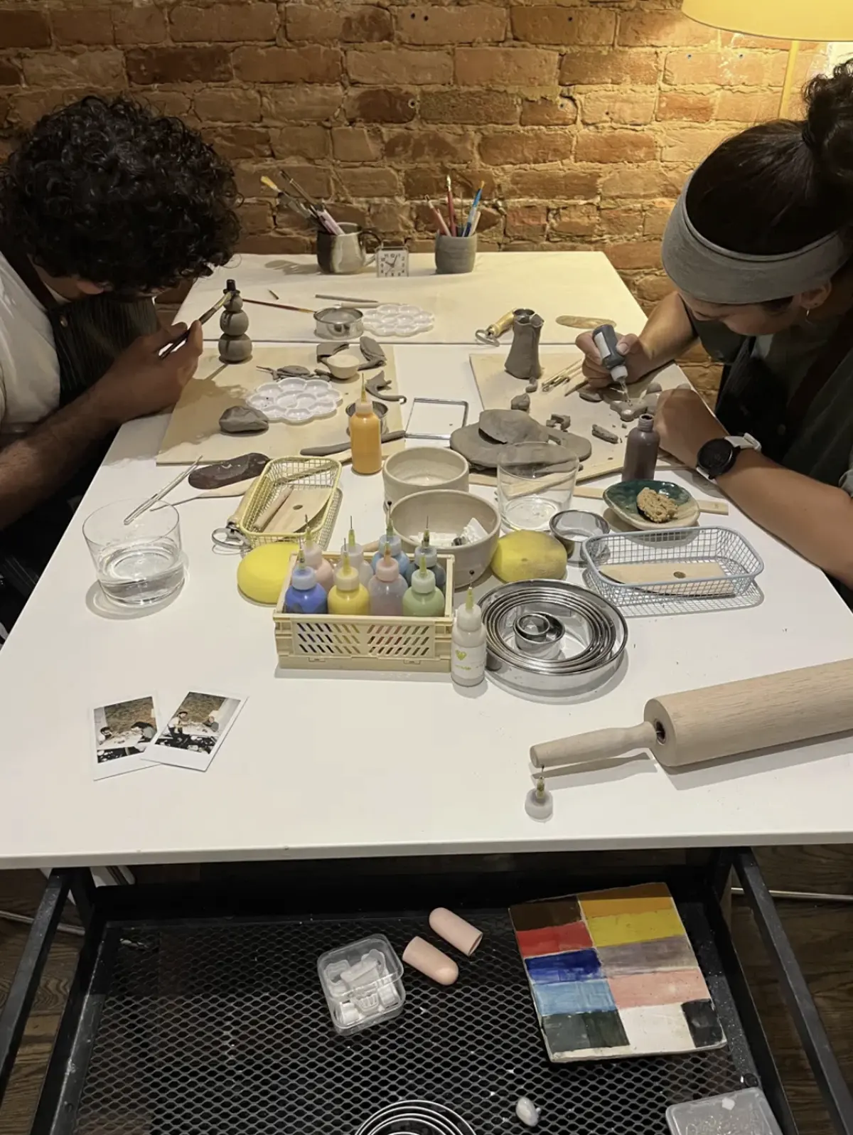 Guests handbuilding pottery at the SAH Studio table