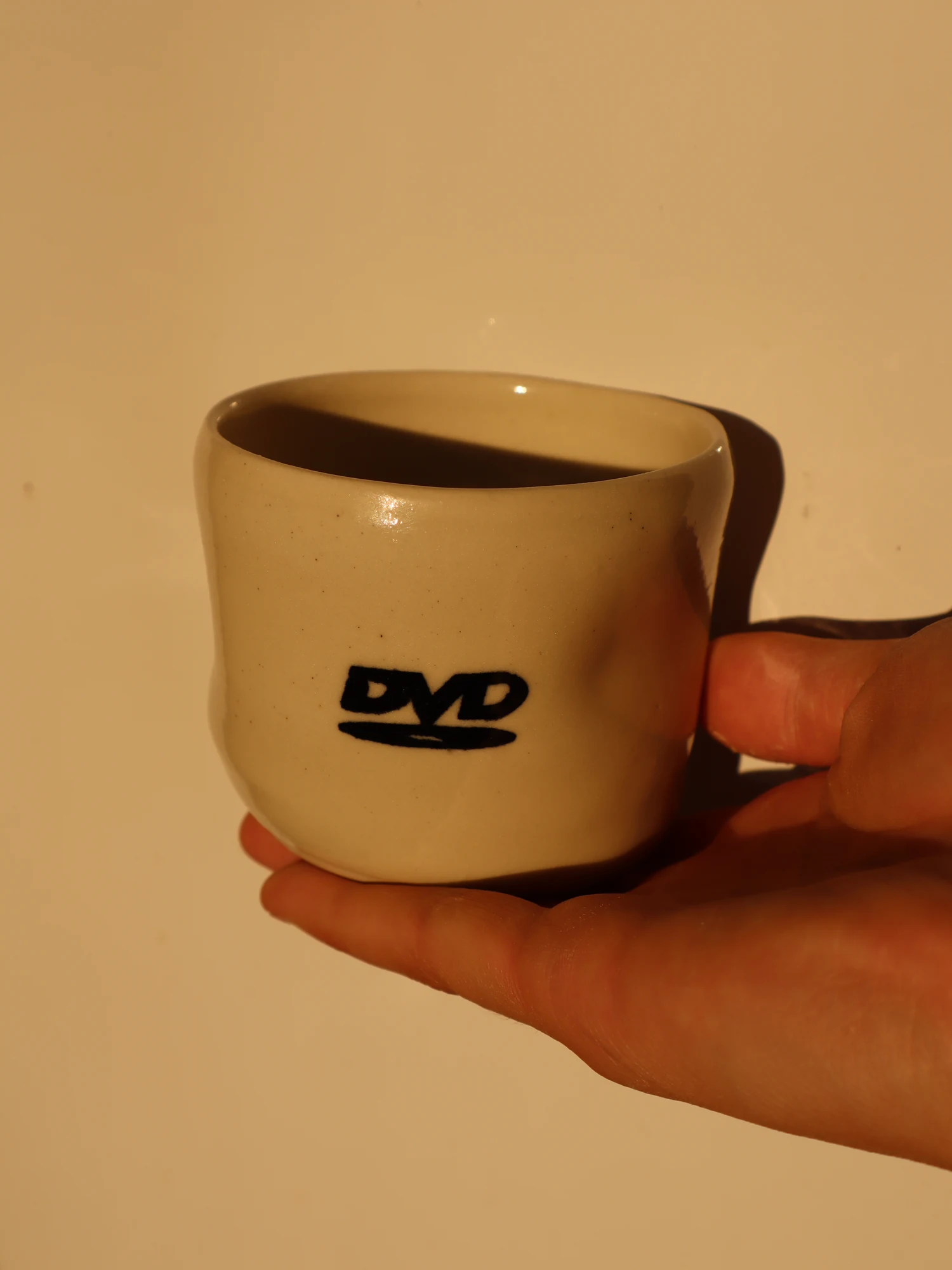 coffee cup - DVD (sample) side view