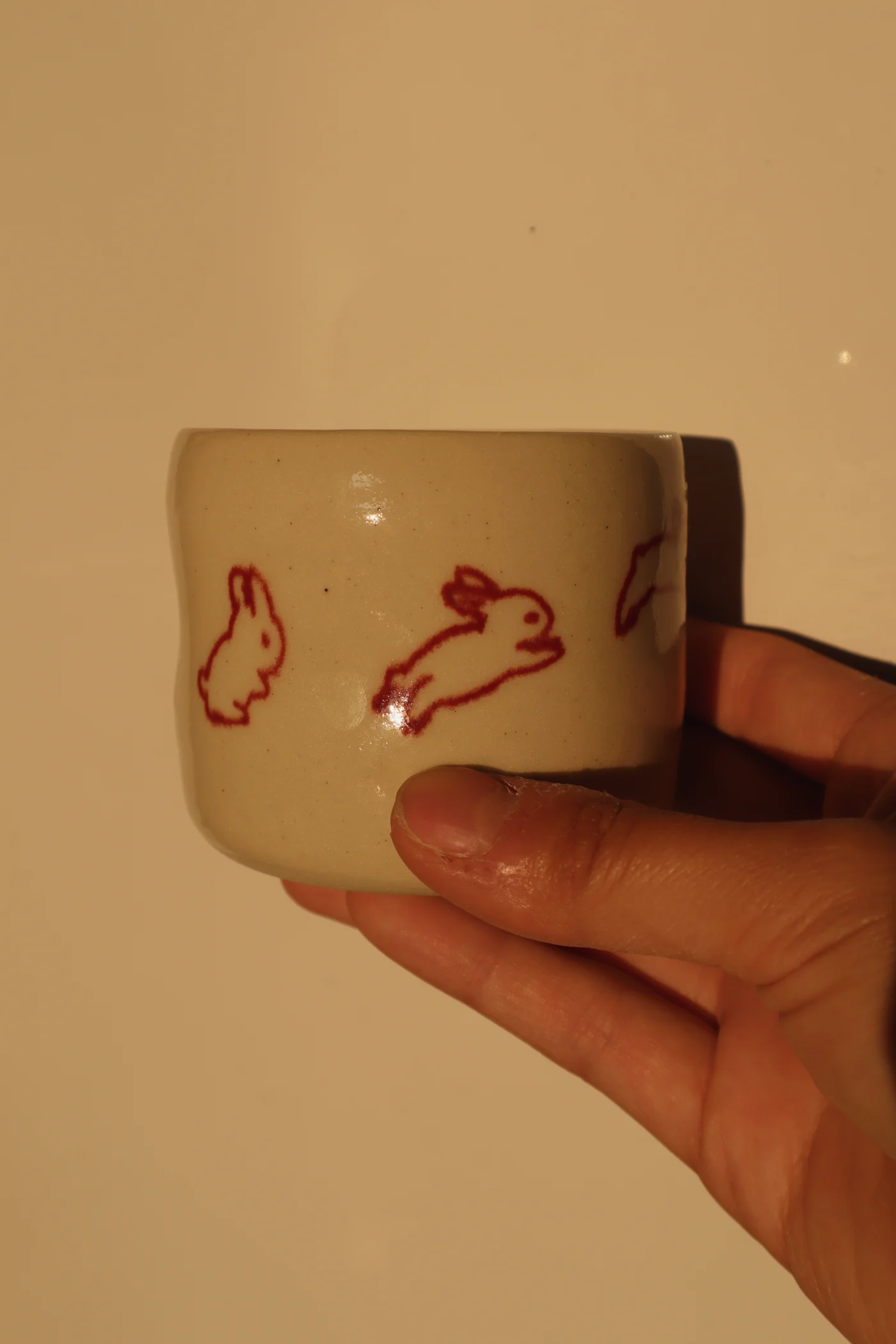 Coffee cup with running bunny illustrations