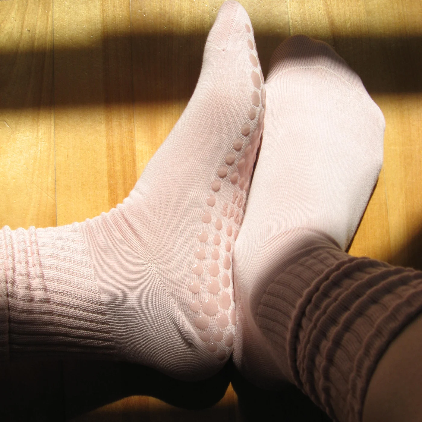 SAH grip socks worn in morning light